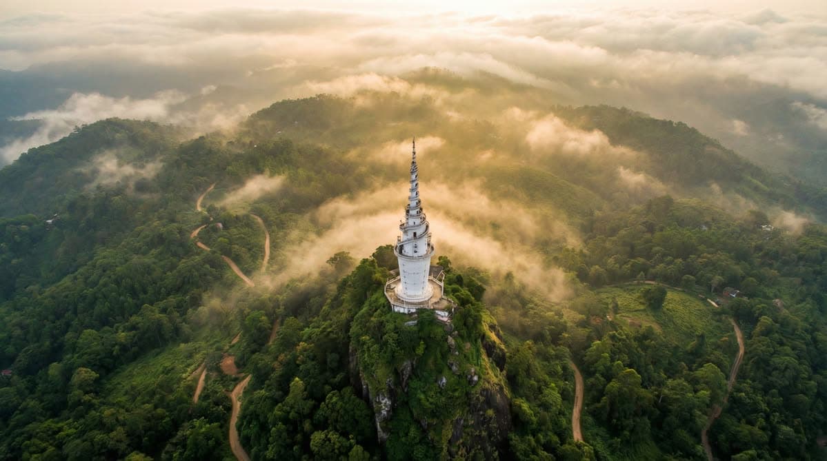 Ambuluwawa tower rising through mist above the highlands — the photograph that anchors the manifesto